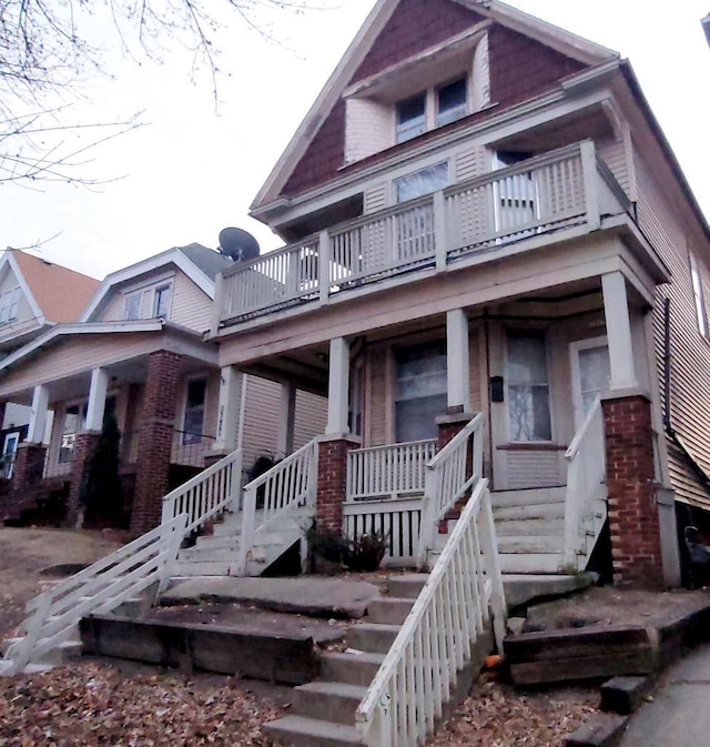 view of front of house with stairs and a porch