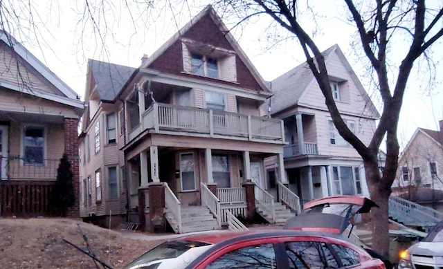 view of front of house featuring a balcony