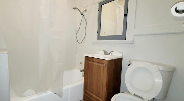 bathroom with toilet, shower / bath combo with shower curtain, and vanity