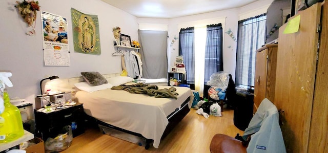 bedroom with wood finished floors