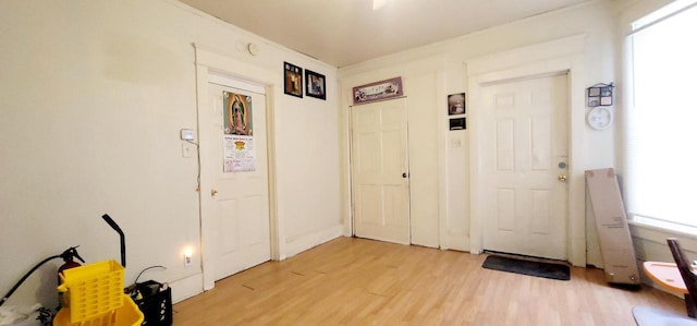 foyer featuring wood finished floors