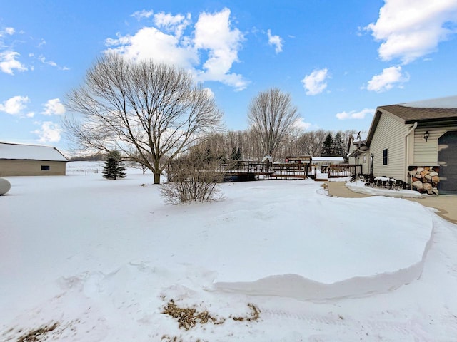 view of yard layered in snow