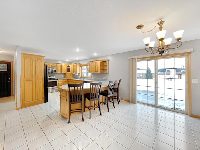 kitchen with light tile patterned flooring, stainless steel appliances, a peninsula, a kitchen breakfast bar, and open shelves