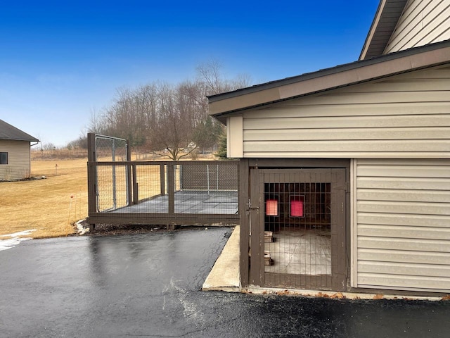 wooden deck featuring a gate