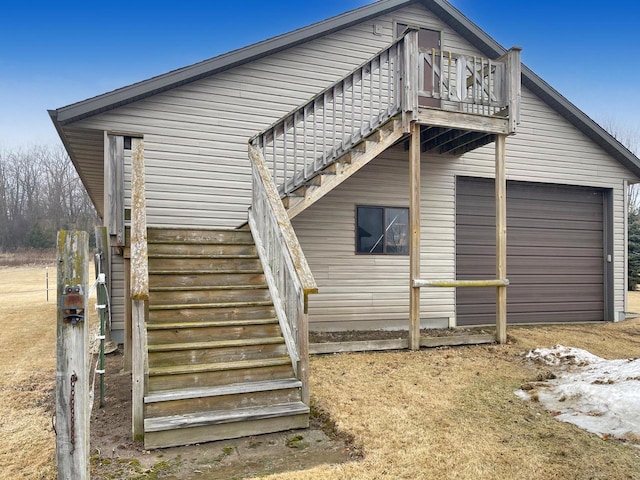 view of home's exterior with a balcony and stairs