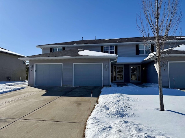 view of front of property with driveway and an attached garage