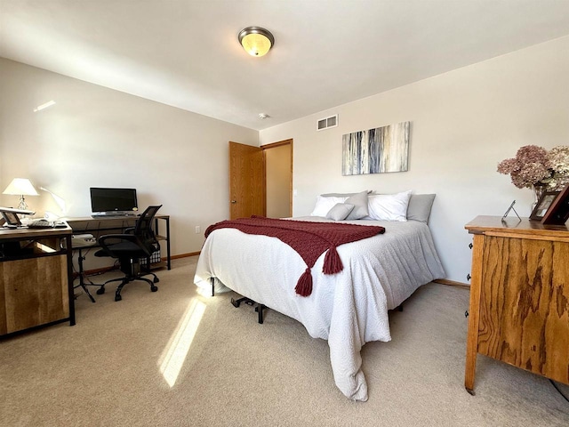 bedroom featuring light carpet, baseboards, and visible vents