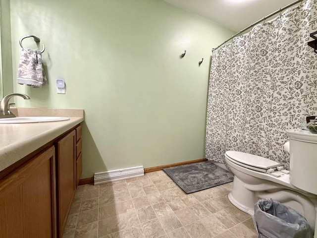 full bathroom featuring vanity, toilet, and baseboards