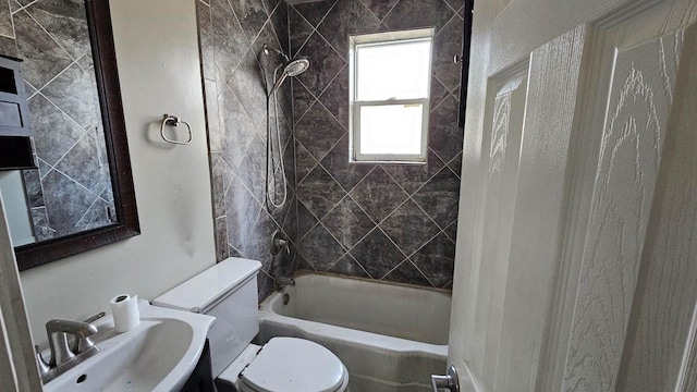 bathroom with  shower combination, a sink, and toilet