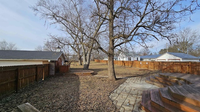 view of yard with a fenced backyard