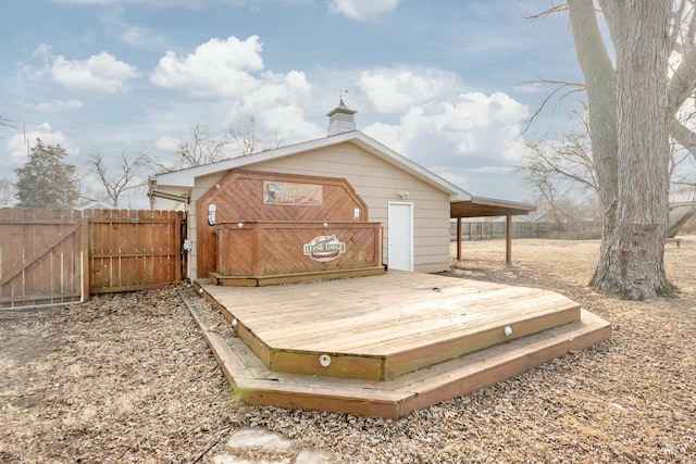 deck featuring fence and a gate