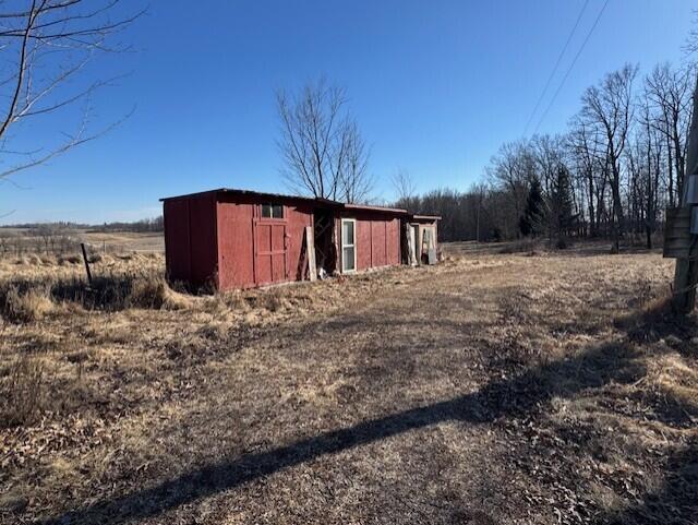 E7478 Hinkst Hollow Rd, Viroqua, WI 54665 - view of shed featuring a rural view