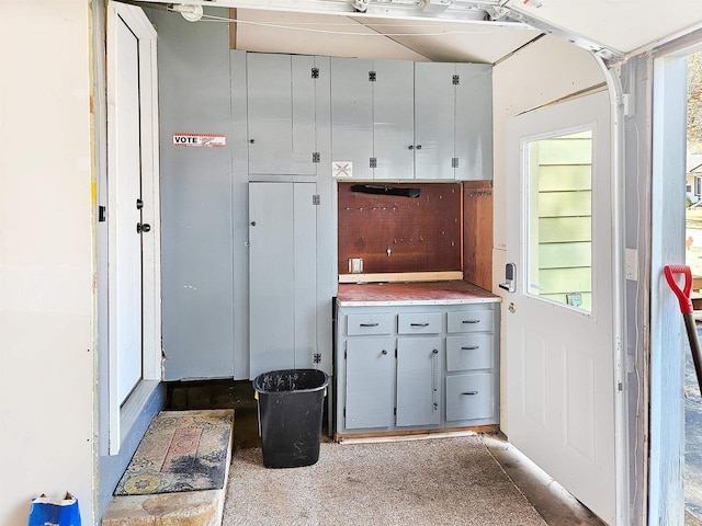 kitchen featuring gray cabinets and light countertops