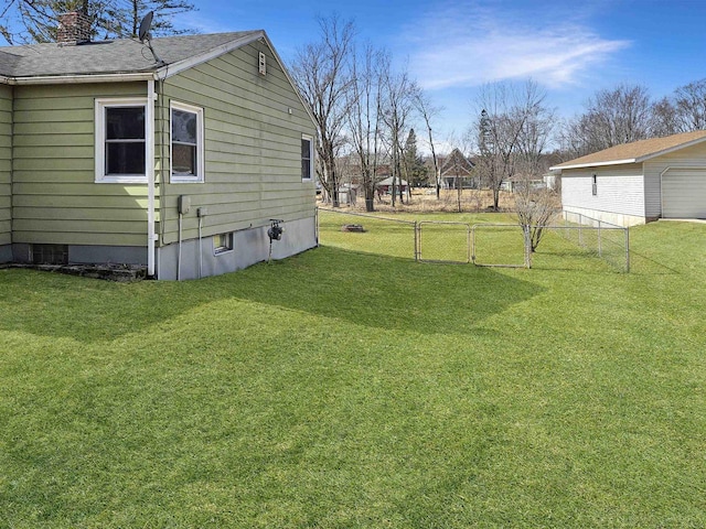 view of yard featuring fence and a gate