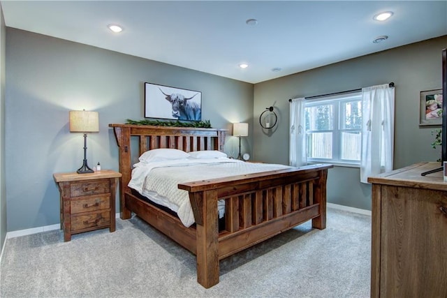 bedroom with recessed lighting, baseboards, and light colored carpet