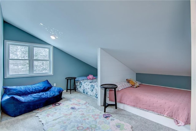 carpeted bedroom featuring vaulted ceiling