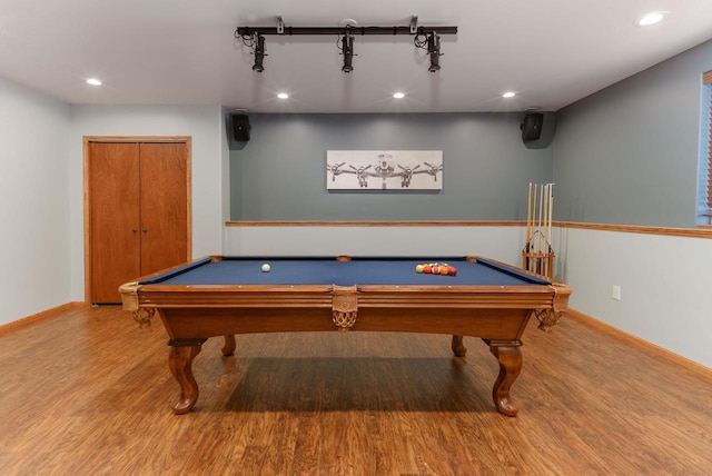 recreation room featuring baseboards, wood finished floors, and recessed lighting