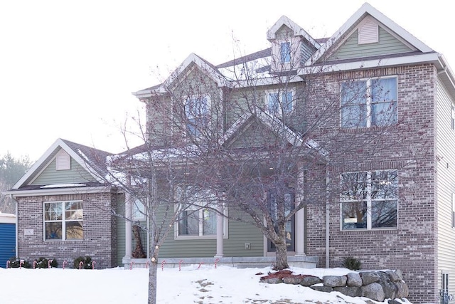 view of front of house featuring brick siding