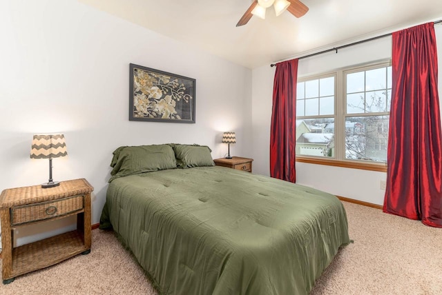 bedroom featuring ceiling fan, carpet flooring, and baseboards