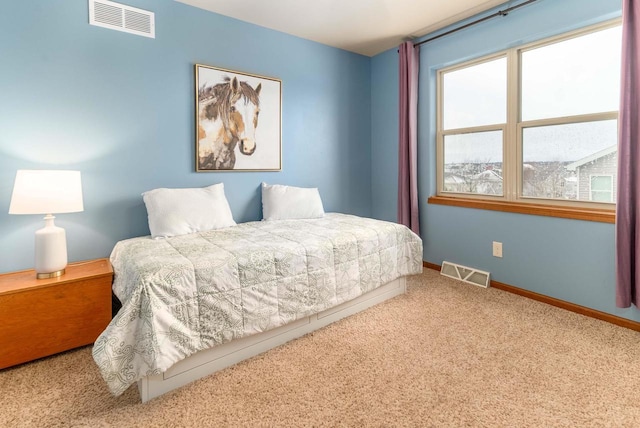 bedroom featuring carpet, visible vents, and baseboards