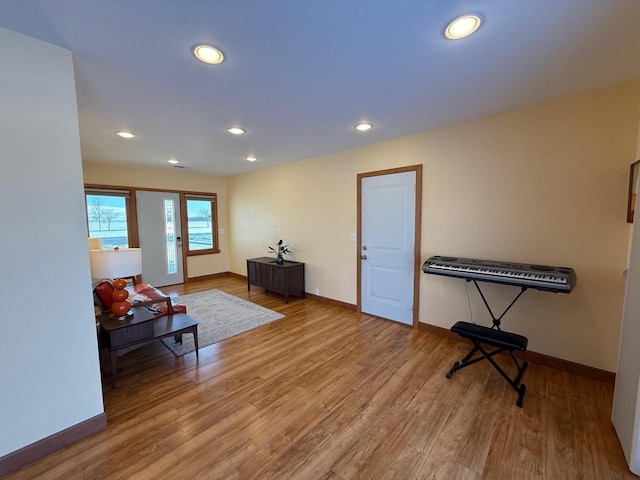 interior space featuring recessed lighting, wood finished floors, and baseboards