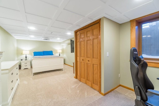 bedroom featuring baseboards, coffered ceiling, and light colored carpet