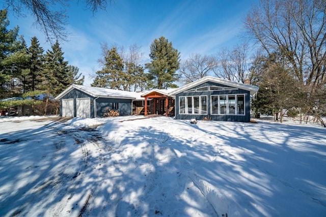 view of front of property with an outbuilding and an attached garage