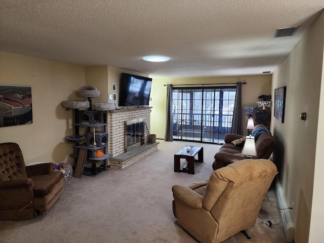 living area with carpet, a textured ceiling, a brick fireplace, and visible vents