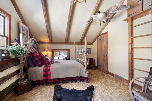 bedroom featuring beam ceiling, multiple windows, visible vents, and baseboards