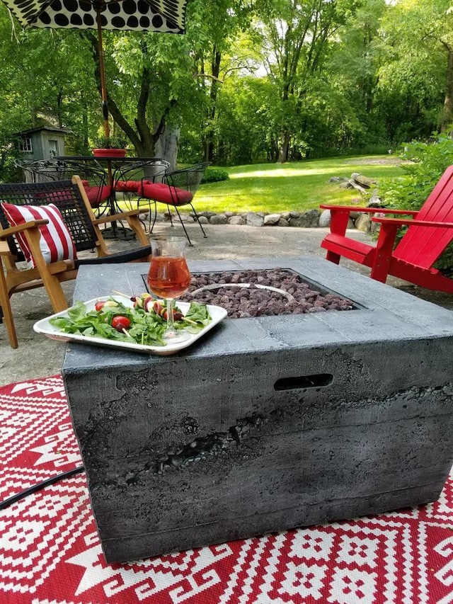 view of yard with a patio area and a fire pit