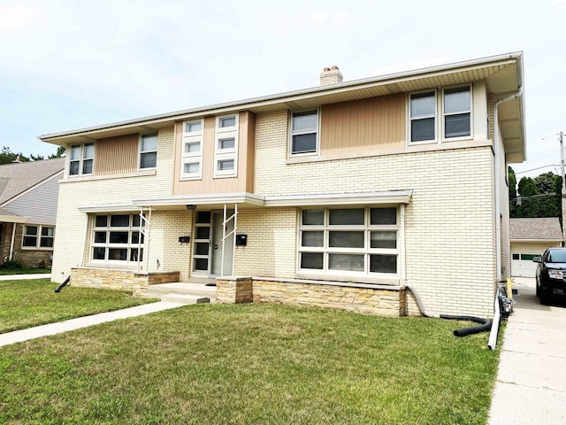 multi unit property featuring entry steps, a front lawn, a chimney, and brick siding