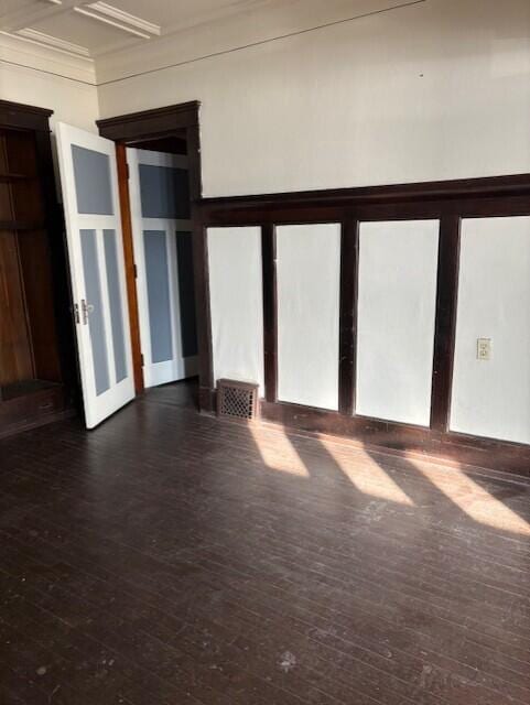 spare room with dark wood-type flooring