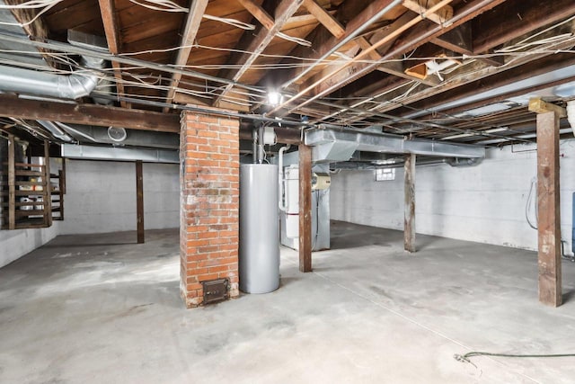 basement with water heater and heating unit