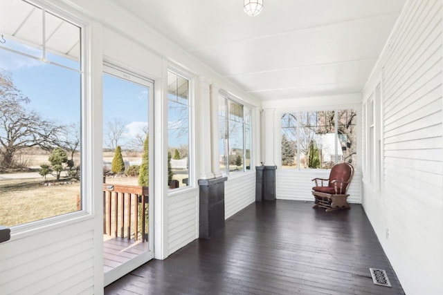 sunroom with a wealth of natural light and visible vents