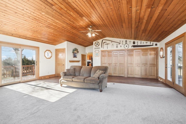 unfurnished living room featuring a healthy amount of sunlight, wooden ceiling, and vaulted ceiling