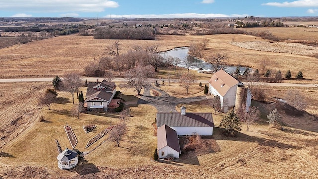 birds eye view of property with a rural view