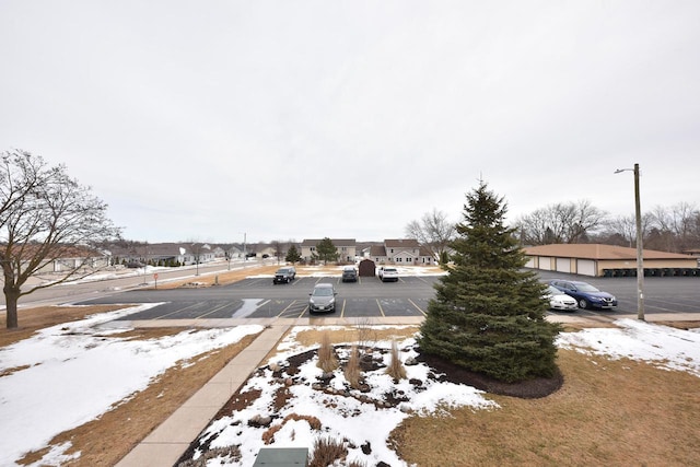 view of road featuring a residential view and sidewalks