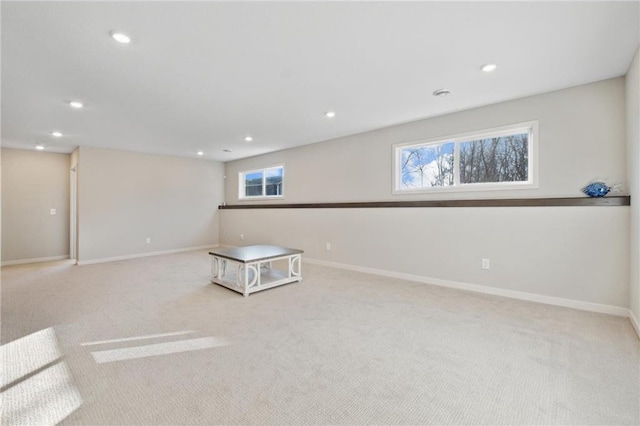 interior space featuring light carpet, baseboards, and recessed lighting