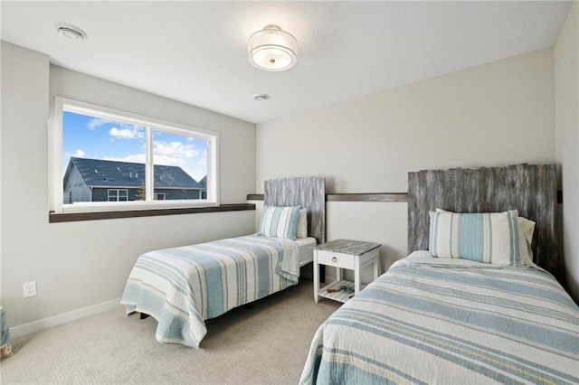 bedroom with carpet and baseboards