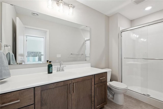 full bathroom with toilet, a shower stall, vanity, and tile patterned floors