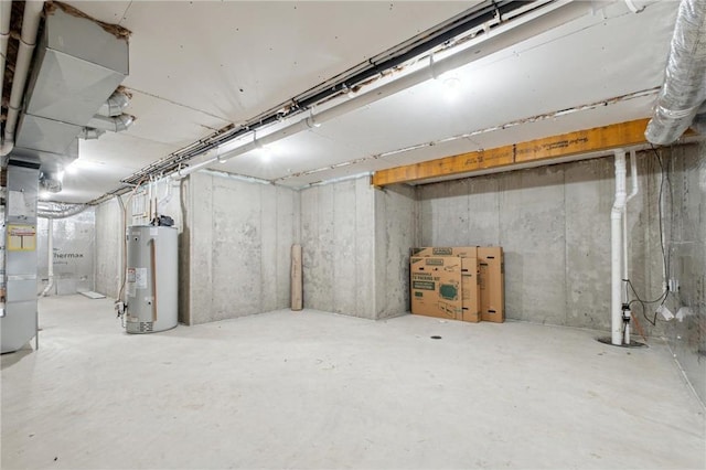 unfinished below grade area featuring water heater and heating unit