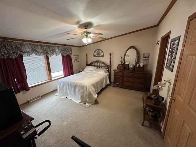 bedroom featuring light colored carpet, visible vents, and crown molding