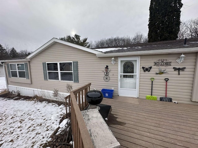 view of snow covered deck