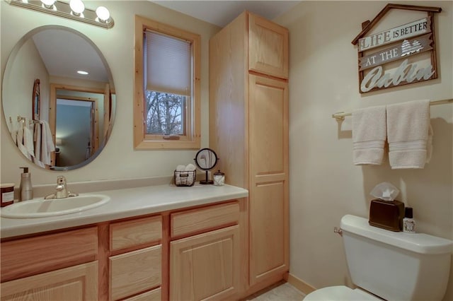 bathroom with vanity and toilet