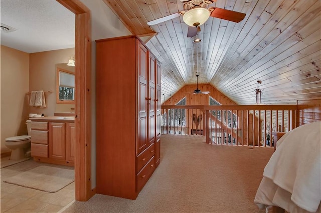 additional living space featuring ceiling fan, lofted ceiling, wooden ceiling, light carpet, and visible vents