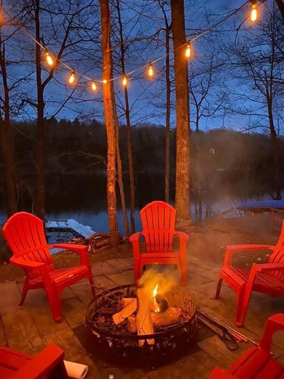 view of patio / terrace with an outdoor fire pit