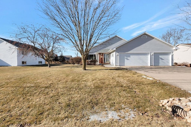 ranch-style home with a garage, driveway, and a front yard