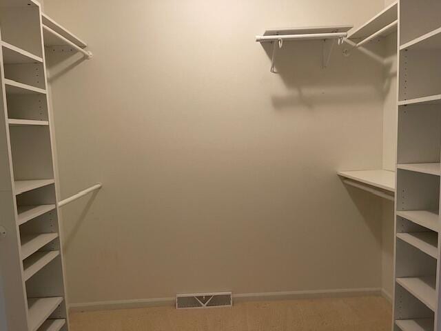 walk in closet with visible vents