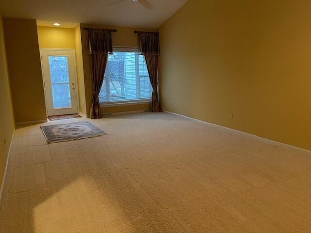 empty room featuring recessed lighting, ceiling fan, and light colored carpet