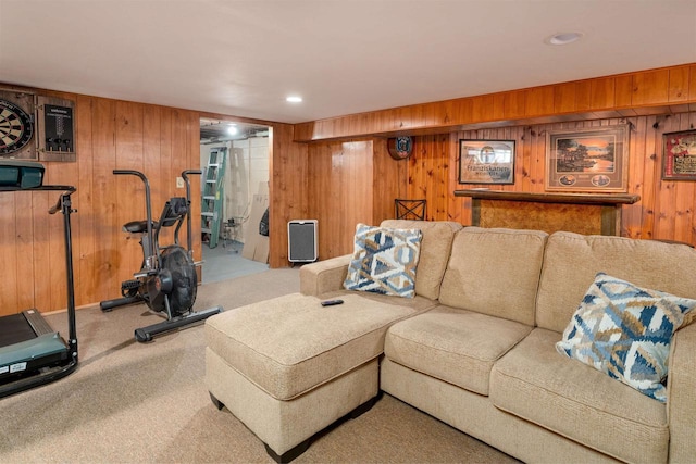 carpeted living room featuring wood walls and recessed lighting